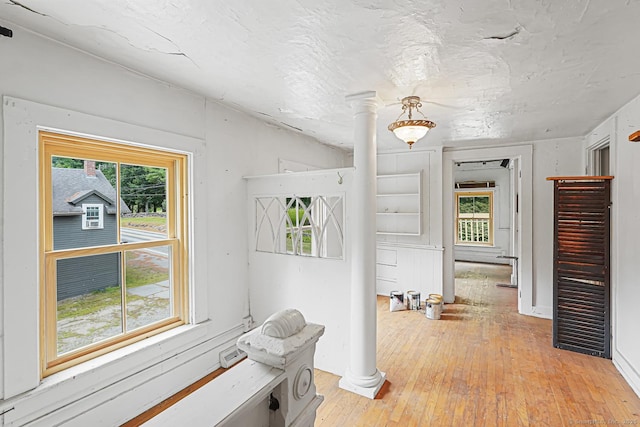 326 Rte 169, Woodstock, CT 06281 - corridor with decorative columns and light wood-style flooring