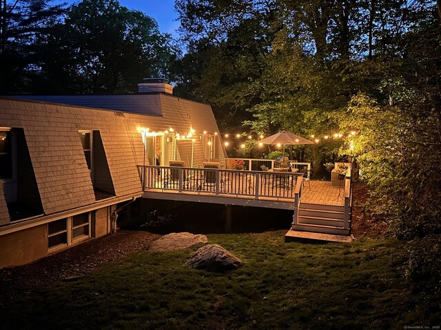 20 Mountain Wood Rd, Stamford, CT 06903 - rear view of house featuring a wooden deck, a yard, and a chimney