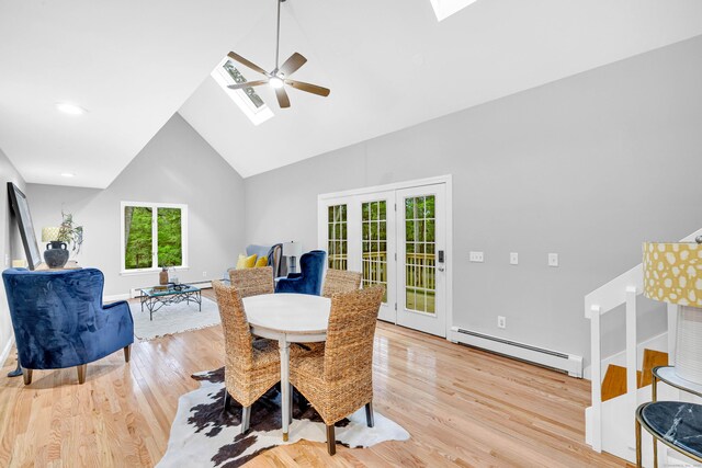 53 Windham Rd, Hampton, CT 06247 - dining room with a skylight, baseboard heating, ceiling fan, high vaulted ceiling, and light wood-style floors