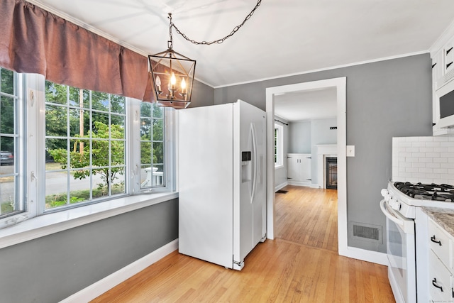 3 Lynette Dr, North Haven, CT 06473 - kitchen with white appliances, light wood-type flooring, healthy amount of natural light, ornamental molding, and a chandelier