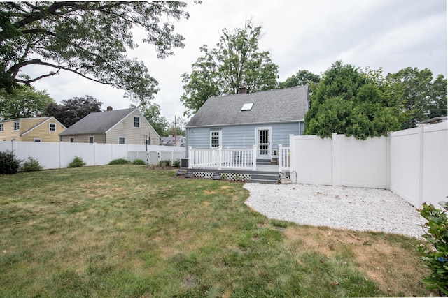 3 Lynette Dr, North Haven, CT 06473 - rear view of property with a fenced backyard, a deck, a chimney, and a shingled roof