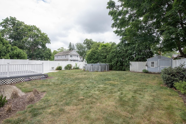 3 Lynette Dr, North Haven, CT 06473 - fenced backyard featuring a storage unit and a wooden deck
