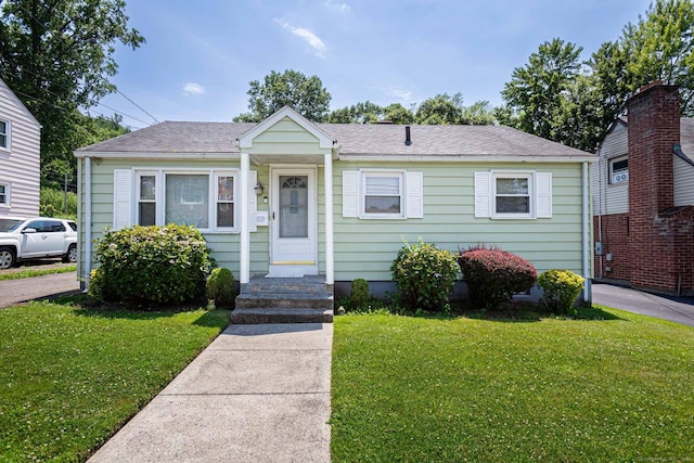 19 Marion St, Hartford, CT 06106 - bungalow-style home with a front lawn and a shingled roof