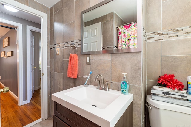 19 Marion St, Hartford, CT 06106 - full bathroom with vanity, tile walls, and wood finished floors
