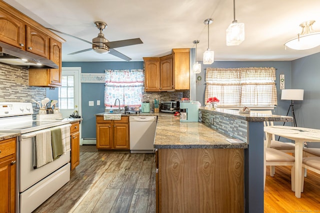 19 Marion St, Hartford, CT 06106 - kitchen with white appliances, under cabinet range hood, a peninsula, and light wood-style floors