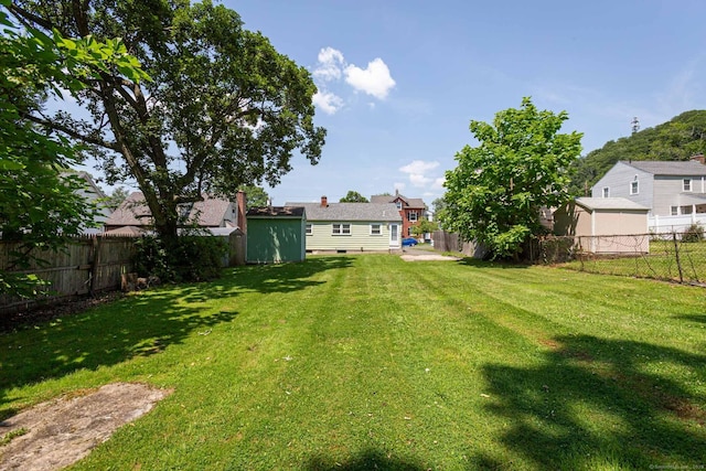19 Marion St, Hartford, CT 06106 - fenced backyard featuring a storage shed