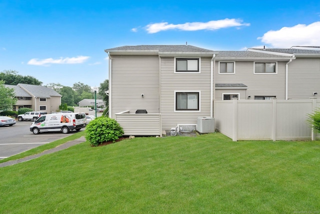 182 Shagbark Dr Unit 182, Derby, CT 06418 - rear view of house with uncovered parking and roof with shingles