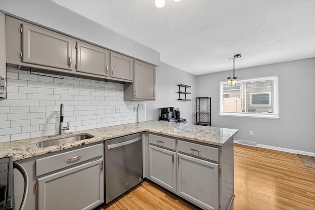 182 Shagbark Dr Unit 182, Derby, CT 06418 - kitchen with gray cabinets, stainless steel dishwasher, a peninsula, backsplash, and a textured ceiling