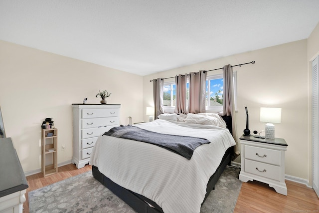 182 Shagbark Dr Unit 182, Derby, CT 06418 - bedroom with light wood-type flooring and baseboards
