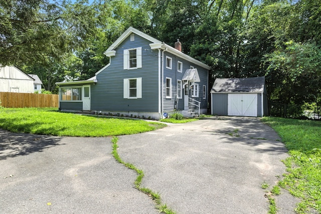 5 Church St Apt R, East Windsor, CT 06016 - view of front of home with a chimney, a shed, asphalt driveway, and entry steps