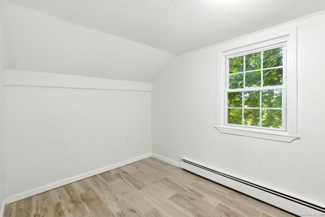 5 Church St Apt R, East Windsor, CT 06016 - bonus room featuring baseboard heating, vaulted ceiling, and light wood-style floors