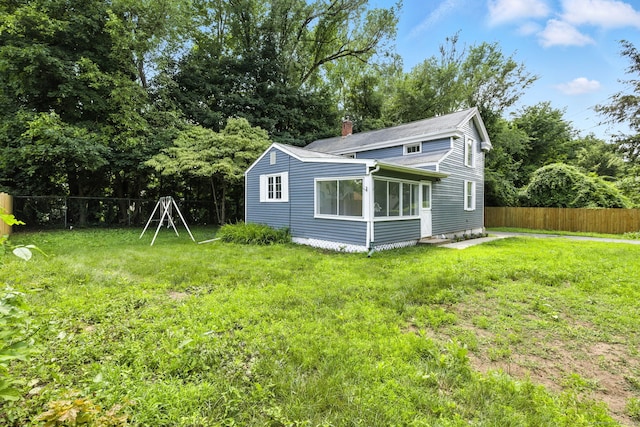 5 Church St Apt R, East Windsor, CT 06016 - back of house featuring a chimney and a fenced backyard