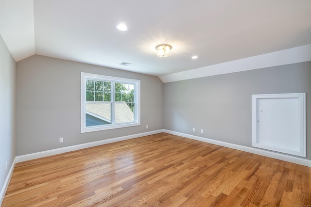 6 Kaatskill Ln, East Lyme, CT 06357 - spare room with lofted ceiling, light wood-style floors, and recessed lighting