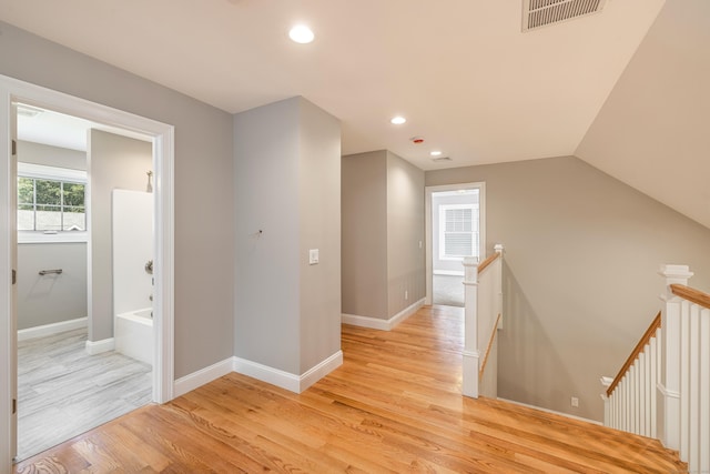 6 Kaatskill Ln, East Lyme, CT 06357 - hallway with an upstairs landing, light wood-style flooring, recessed lighting, and lofted ceiling
