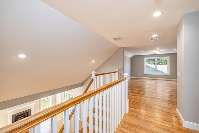 6 Kaatskill Ln, East Lyme, CT 06357 - hallway with light wood finished floors, recessed lighting, lofted ceiling, and an upstairs landing