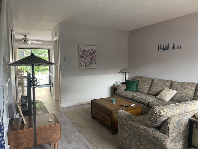 104 N Turnpike Rd Unit B, Wallingford, CT 06492 - living room with a ceiling fan, wood finished floors, and wainscoting