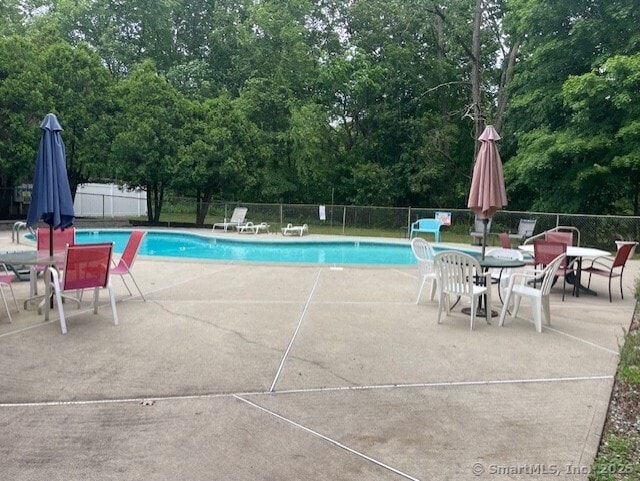 104 N Turnpike Rd Unit B, Wallingford, CT 06492 - community pool with a patio area and outdoor dining area
