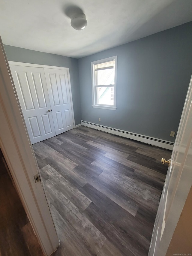 45 Mahl Ave, Hartford, CT 06154 - unfurnished bedroom featuring a baseboard radiator, dark wood-type flooring, and a closet