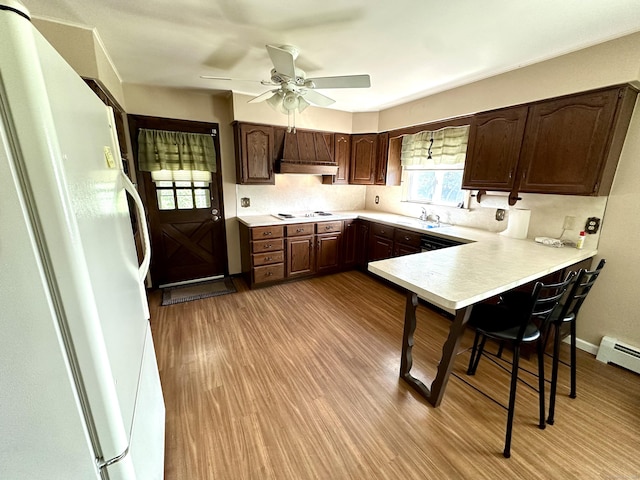 175 Coram Rd, Shelton, CT 06484 - kitchen featuring white appliances, light countertops, ceiling fan, wood finished floors, and dark brown cabinets