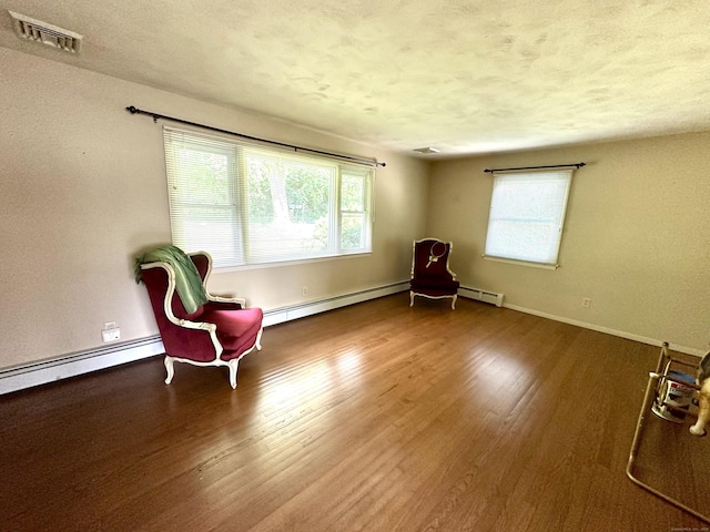 175 Coram Rd, Shelton, CT 06484 - unfurnished room with a baseboard radiator, wood finished floors, and a textured ceiling