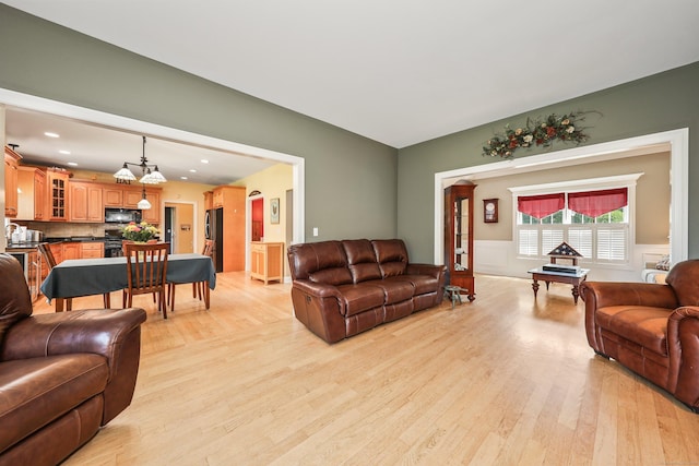 118 Cobblestone Dr, Southington, CT 06479 - living area featuring light wood-style floors, a wainscoted wall, and recessed lighting