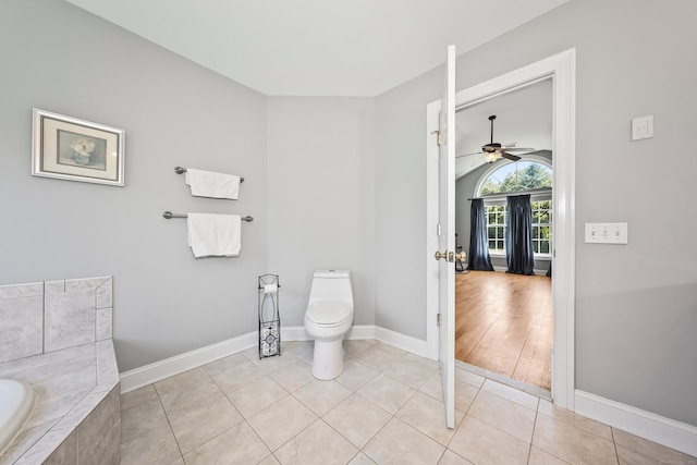 118 Cobblestone Dr, Southington, CT 06479 - bathroom with ceiling fan, a garden tub, tile patterned flooring, and vaulted ceiling