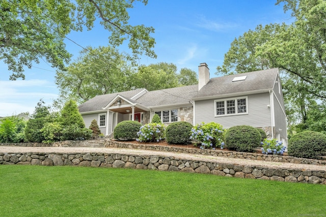 46 Bowman Dr, Greenwich, CT 06831 - view of front of house featuring a chimney, a front lawn, stone siding, and roof with shingles