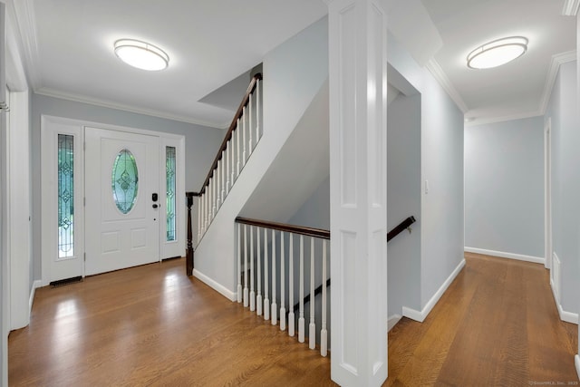 46 Bowman Dr, Greenwich, CT 06831 - foyer with wood finished floors and crown molding