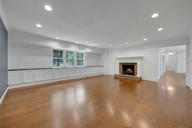 46 Bowman Dr, Greenwich, CT 06831 - unfurnished living room featuring ornamental molding, wood finished floors, a fireplace, and recessed lighting