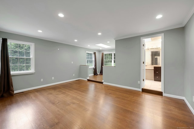 46 Bowman Dr, Greenwich, CT 06831 - empty room featuring ornamental molding, plenty of natural light, wood finished floors, and recessed lighting