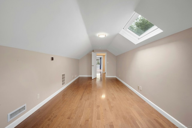 46 Bowman Dr, Greenwich, CT 06831 - bonus room with a skylight, vaulted ceiling, and light wood-style flooring