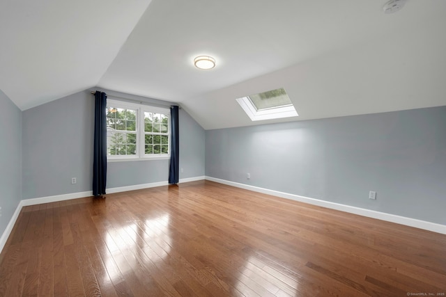 46 Bowman Dr, Greenwich, CT 06831 - additional living space with a skylight, hardwood / wood-style floors, and vaulted ceiling