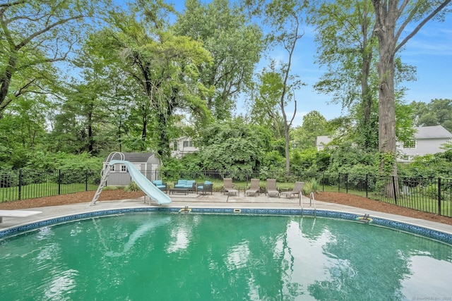 46 Bowman Dr, Greenwich, CT 06831 - view of pool with a water slide, a patio area, and view of scattered trees