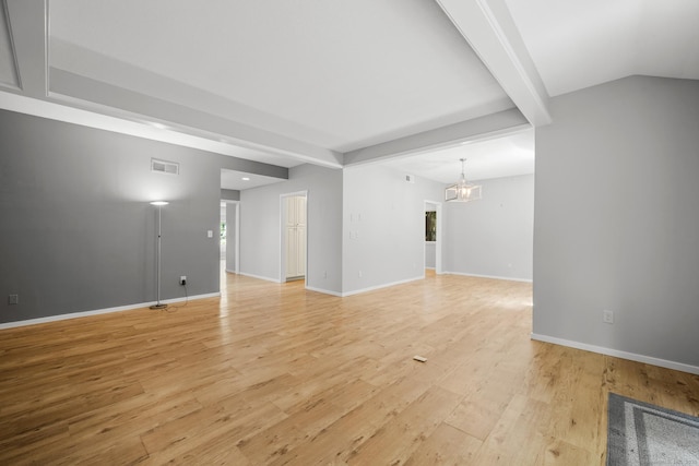 737 Heritage Vlg Unit A, Southbury, CT 06488 - unfurnished living room featuring light wood finished floors, a chandelier, and beamed ceiling