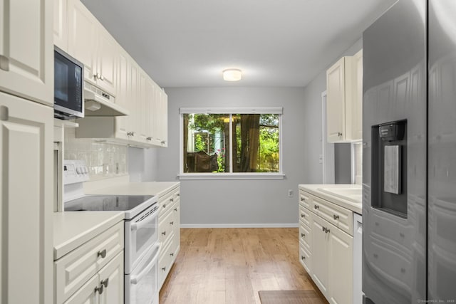 737 Heritage Vlg Unit A, Southbury, CT 06488 - kitchen featuring electric stove, refrigerator with ice dispenser, under cabinet range hood, light countertops, and light wood finished floors