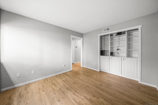 737 Heritage Vlg Unit A, Southbury, CT 06488 - spare room with baseboards and light wood-style flooring