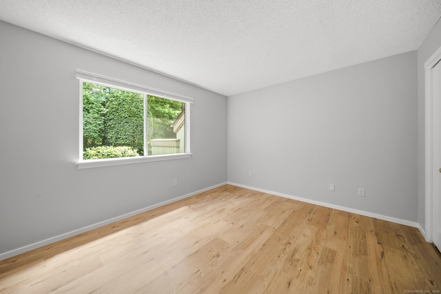 737 Heritage Vlg Unit A, Southbury, CT 06488 - unfurnished room featuring wood finished floors and a textured ceiling