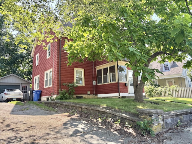 23 Carely Ave, Griswold, CT 06351 - view of front of property with a garage and an outdoor structure
