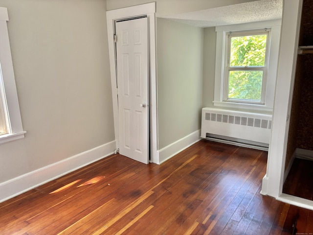 23 Carely Ave, Griswold, CT 06351 - unfurnished bedroom featuring radiator heating unit and hardwood / wood-style flooring