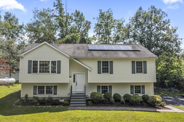 24 Ken Oaks Dr, Danbury, CT 06810 - split foyer home with solar panels, a front lawn, and roof with shingles