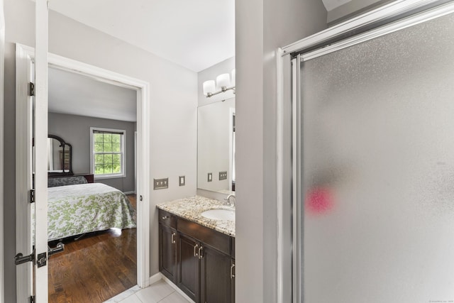 24 Ken Oaks Dr, Danbury, CT 06810 - full bathroom with vanity, a stall shower, connected bathroom, and wood finished floors