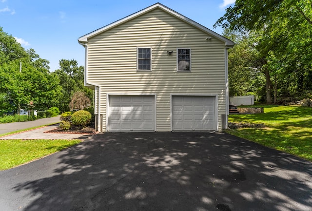 24 Ken Oaks Dr, Danbury, CT 06810 - view of side of home with driveway, a garage, and a lawn