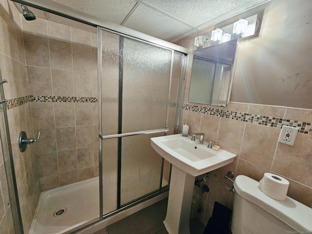 209 Maple St, East Hartford, CT 06118 - bathroom featuring a shower stall and tile walls