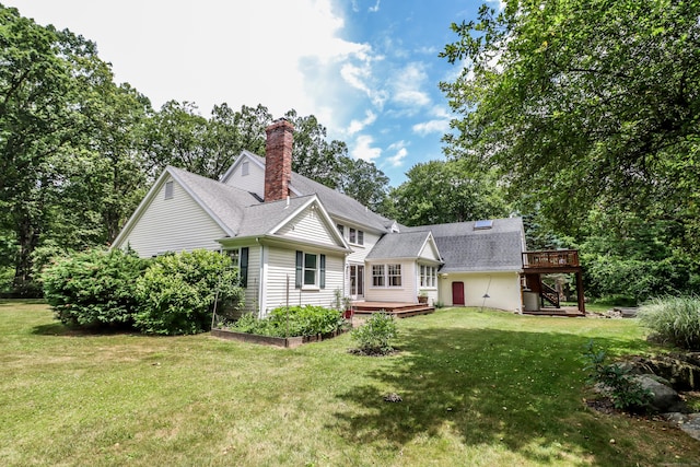 35 Vista Rd, Wilton, CT 06897 - rear view of house with a deck, a chimney, a yard, and a shingled roof