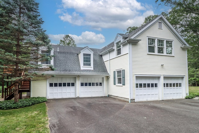 35 Vista Rd, Wilton, CT 06897 - view of front of property with asphalt driveway, a shingled roof, and a garage