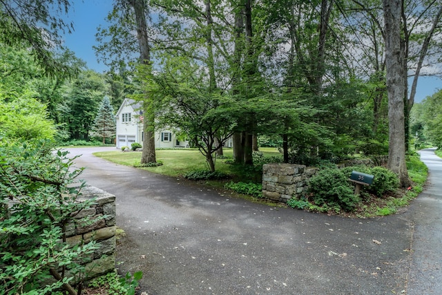 35 Vista Rd, Wilton, CT 06897 - surrounding community featuring asphalt driveway, a yard, and an attached garage