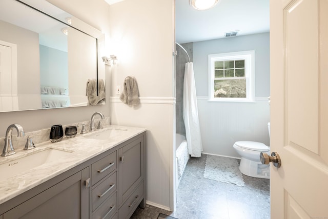 30 Partridge Rd, Stamford, CT 06903 - ensuite bathroom with a wainscoted wall, double vanity, and shower / bathtub combination with curtain