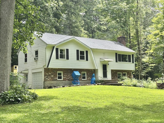 3 Millstream Rd, Hebron, CT 06231 - view of front of house featuring brick siding, a chimney, a front lawn, and a garage