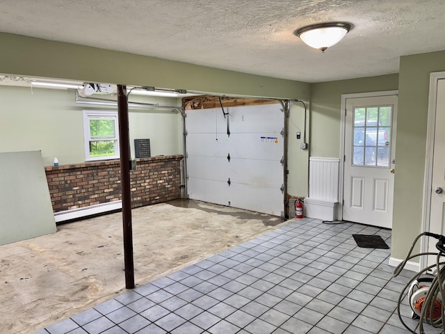 3 Millstream Rd, Hebron, CT 06231 - garage featuring baseboard heating