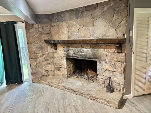 3 Millstream Rd, Hebron, CT 06231 - detailed view of wood finished floors and a stone fireplace